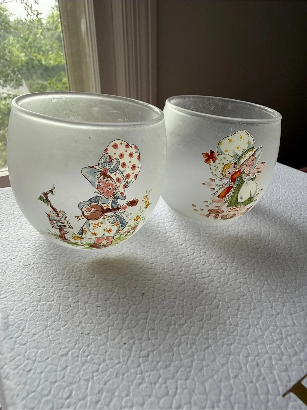 Vintage frosted glass tea light candle holders with a handmade doll design